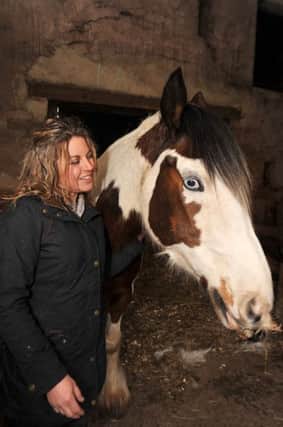 Feature on the Coloured Cob riding school which has won an award for its work with riders with mental health problems, pictured is owner Sharon Tolley with Charlie (w130315-4b)
