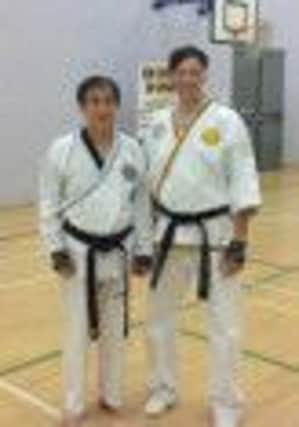 Master Andrew Blinston, Chief Instructor of Lynx Black Belt Leadership Academy in Retford, with Grand Master Kim Yong Ho