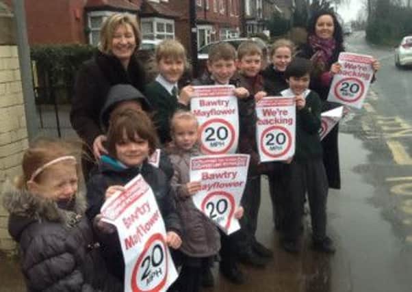 Headteacher Julie Jenkinson and school council members joined Caroline Flint to show their views about traffic speed