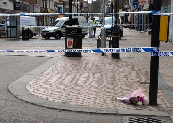Flowers at the scene where a 40-year-old man died on Saturday night
