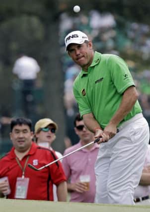 Lee Westwood, of England chips to the 17th green during the first round of the Masters golf tournament Thursday, April 11, 2013, in Augusta, Ga. (AP Photo/David J. Phillip)