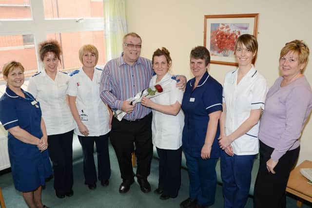 Graham Bacon presents the Guardian Rose to the staff on ward B5 at Bassetlaw Hospital G130419-4a