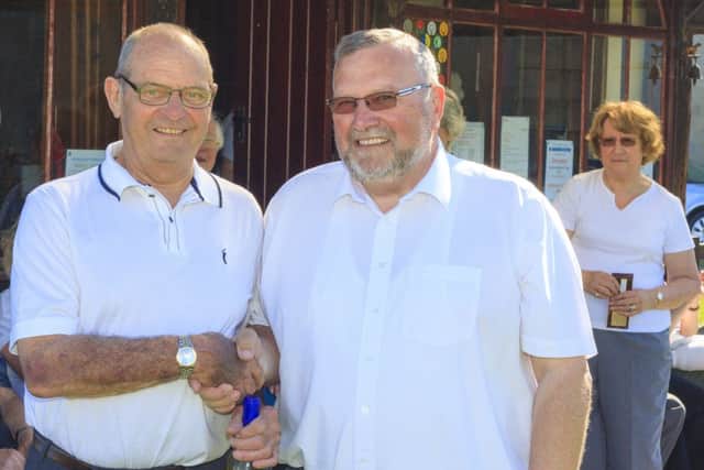 John Hallam, on the left of the picture receiving a bottle of wine from Andy Pointon, event organiser.