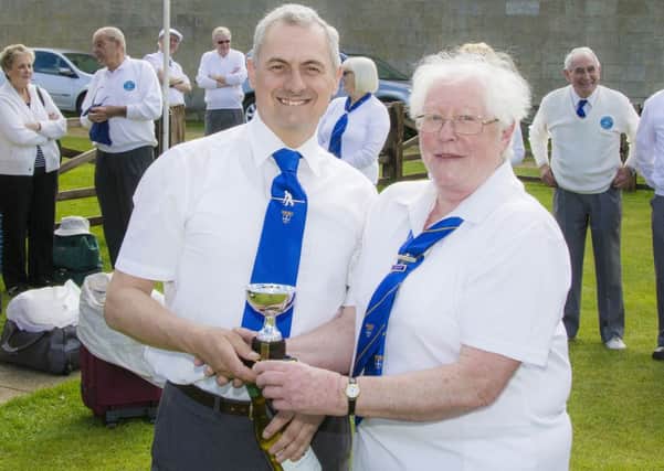 David Gascoyne seen in the photo being presented with the cup and a bottle of wine by Hilary Wignell team Captain for 2013