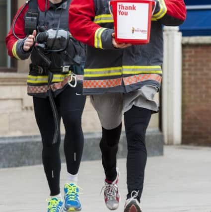 Firefighters Paul Mclafferty and Russell Kay who with the support of Natwest Retford Branch Manager are collecting sponsors to raise funds for The Firefighters Charity as part of team who will be jogging 100K from London to Brighton4 March  2013Image © Paul David Drabble