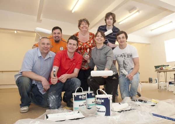 Julie Turner (centre) of Julie Turner Stage Academy thanked work colleagues from Tesco Dinnington store, (left to right); Ian Davies, Mikey Smith, James Davy, Clare Gelder, Luke Fitzpatrick and Will Ives, for helping to re-decorate the Julie Turner Stage Academy Studio 77 premises in Dinnington on Tuesday following fundraising activities at the store