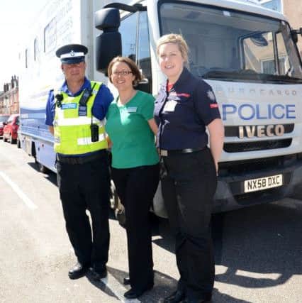 West Lindsey District Council, Lincs Police and Lincs Fire Service held a drop in surgery on Stanley Street in Gainsborough. Pictured are PCSO Mel Crabtree, Hannah Cann, Empty Property Officer at WLDC, Alison White from Lincs Fire Service G130604-3a
