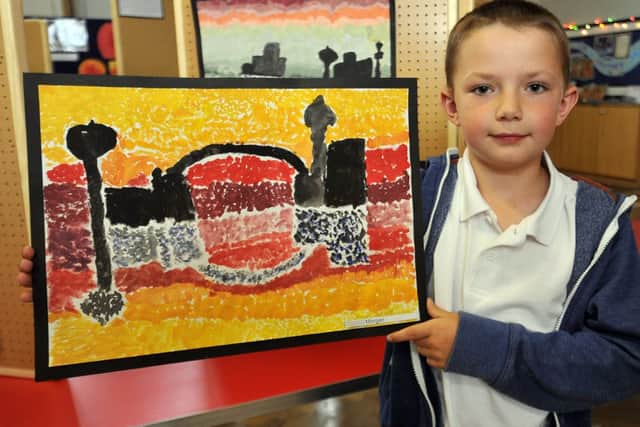 Woodsetts Primary School held an exhibition of art work from all year groups at the school.  Pictured is Morgan with his painting (w130605-2f)