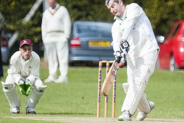 Everton Batsman John Waghorn hits a for from a ball  by Lee Stead watched by Marshalls wicket keeper Jamie Flavel during play at Marshalls ground worksop on Saturday afternoon11 May 2013Image © Paul David Drabble