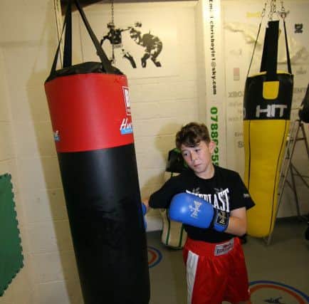 Regan Pettinger training on one of the bags