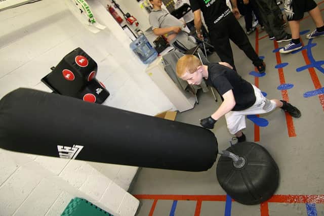 Young Sam training on one of the bags