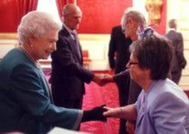 Bluebell Wood volunteers Sandra and Jeff Hind meet the Queen and the Duke of Edinburgh