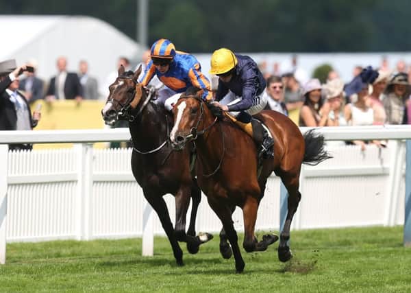 Hillstar ridden by Ryan Moore (right) on his way to winning the King Edward VII Stakes ahead of Battle Of Marengo ridden by Joseph O'Brien