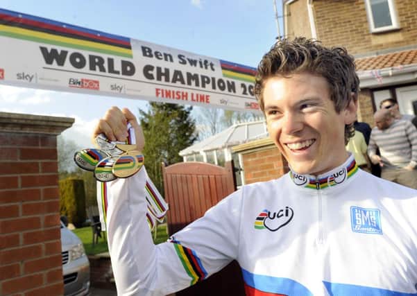 Pictured is local cyclist Ben Swift returning home to Whiston,Rotherham,from the World Championships in Australia where he won a Gold and 2 silver medals.Ben with his mum and dad Sandy & Mark and girlfiend Lizi Hamshaw