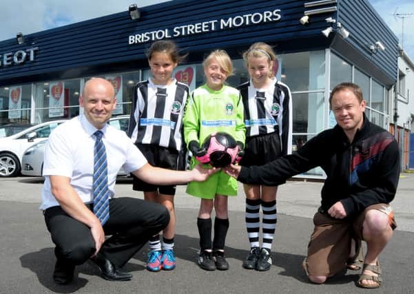 Libby Mowbray aged 10, Taryn Hill (10) and Leah Markham (9). Team Manager is Scott Mowbray. They are pictured with Bristol Street Motors Peugeot Worksop General Manager Andrew Brown.