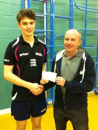 Pictured is Worksop's Sam Walker reigning English U21 National Champion who is receiving a cheque from Andy Lee Chairman of The Worksop & District Table Tennis League in recognition of all Sam's achievements in the sport.