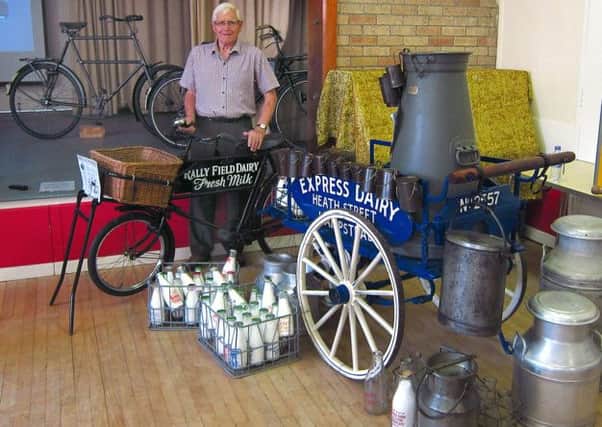 Ray Denton beside a display of equipment used from farm to doorstep delivery of  the milking trade.