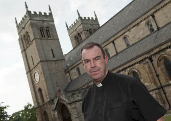 Father Nicolas  Spicer at Priory Church, Worksop were theives broke into the boiler room and stole fixtures and fittings