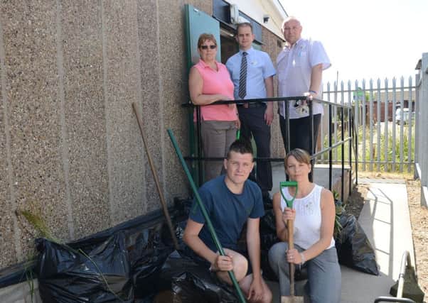 Staff from Tesco in Dinnington helped to tidy up the area around the Scout hut on Laughton Road G130709-3a