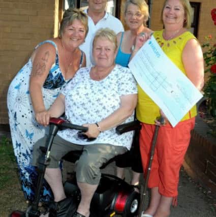 Kilton Forest Community centre, Worksop, have been able to help two good causes, with Clairvoyance eveings, held at the centre.They have provided a £720 Mobility Scooter for terminally ill group member Hazel Bonser of Langold, and presented £300 to Lincs & Notts Air Ambulance. Pictured are Hazel Bonser on her Mobility Scooter, with Pam, Sue Downing and Paula Parry, organisers, and Hazel's husband Tom Bonser. (w130722-1b)