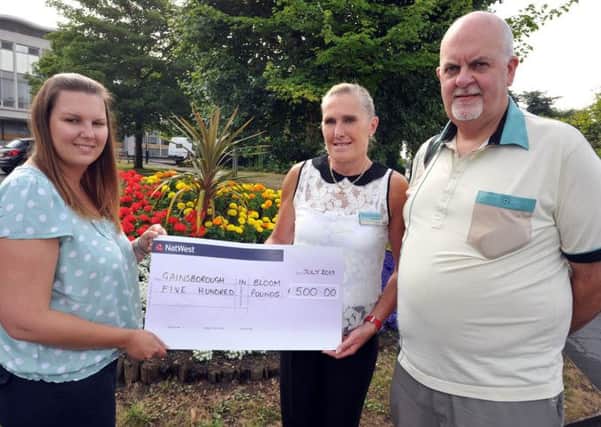 Cheque presentation to Gainsborough in Bloom, pictured from left town centre manager Samantha Dodd, Gainsborough in Bloom tresurer Anna Grieve and secretary Vaugh Hughes (w130724-2)