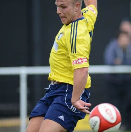 Worksop Town v Mansfield Town. Tigers player Jack Muldon and Mansfield player Ritchie Sutton G130710-4a