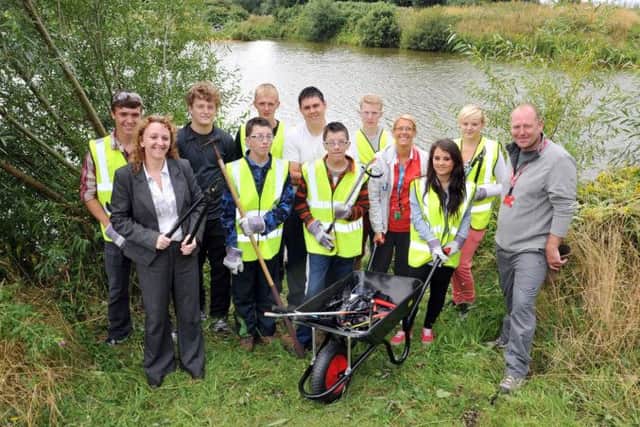 Young people from North Notts College helped to clean up the area around Sandhill Lake as part of the National Citizen Service programme. Pictured with them are Coun Julie Leigh and tutors Mick Cox, Dawn Meakin and ex-student Liam Broadley (w130806-3a)