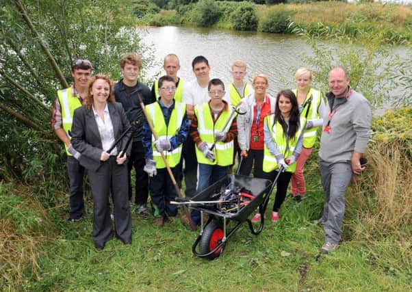 Young people from North Notts College helped to clean up the area around Sandhill Lake as part of the National Citizen Service programme.  Pictured with them are Coun Julie Leigh and tutors Mick Cox, Dawn Meakin and ex-student Liam Broadley (w130806-3a)