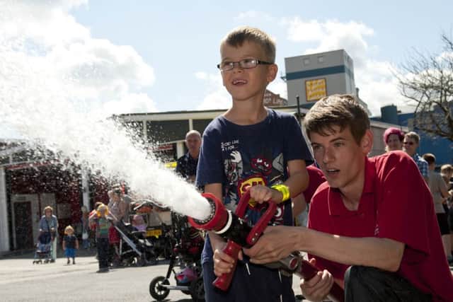 Worksop Fire Station hosted a fun day on Saturday to mark the stations 50th anniverary. Ben Austin mans the fire hose with Terry Price of the Princes Trust