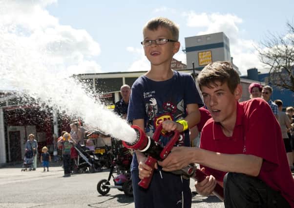 Worksop Fire Station hosted a fun day on Saturday to mark the stations 50th anniverary. Ben Austin mans the fire hose with Terry Price of the Princes Trust