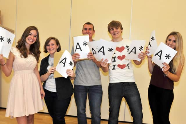 A Level results 2013, high achieving students at Outwood Post 16 Centre celebrate their results.  Pictured from left are Isabelle Jefford, Ellen Greyling, Ryan Brown, Liam Rodgers and Elise Marks (w130815-1a)