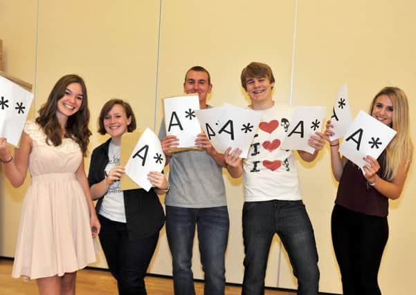 A Level results 2013, high achieving students at Outwood Post 16 Centre celebrate their results.  Pictured from left are Isabelle Jefford, Ellen Greyling, Ryan Brown, Liam Rodgers and Elise Marks (w130815-1a)