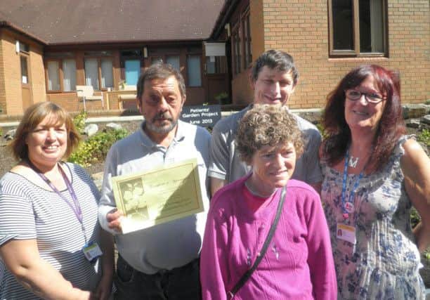 Rotherham, Doncaster and South Humberside (RDaSH) staff and service users celebrate the success of the gardening project at a coffee morning.