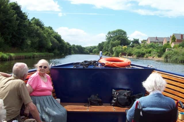Residents from HC-One Swallownest Care Home enjoying the scenery on the boat trip
