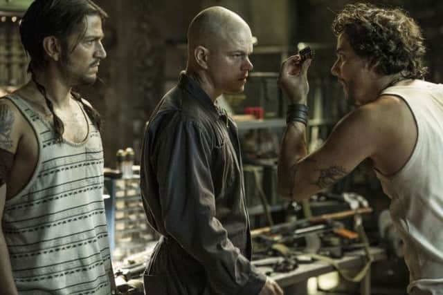 Max (MATT DAMON, center), Julio (DIEGO LUNA, left) and Spider (WAGNER MOURA) meet inside Spider's armory in Columbia Pictures' ELYSIUM.