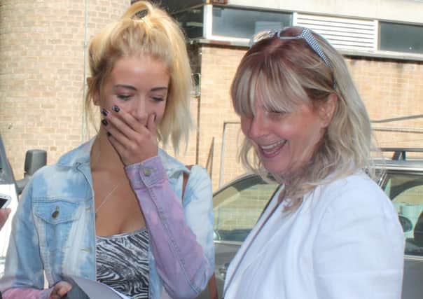 Jennifer Reid with her mum Heather opening her GCSE results envelope