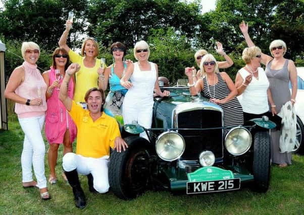 Polo tournament organised by Bawtry Retailers Association in aid of Aurora Wellbeing Charity, pictured are polo ladies with a vintage 1948 Bentley Mark 5 (w130820-1i)
