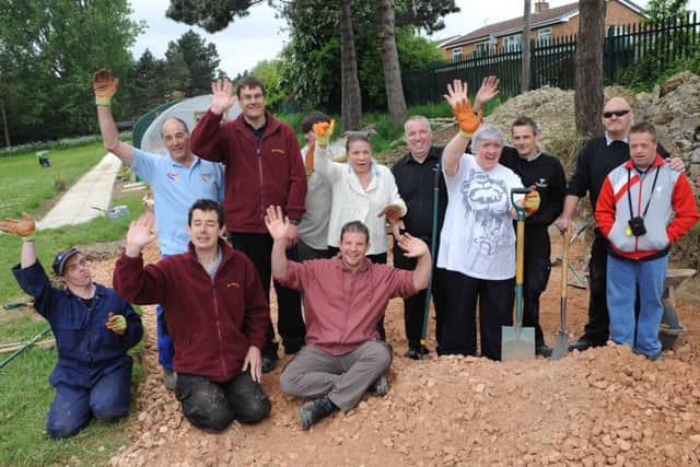 Service users at Rotherham Council's Addison Centre were delighted by a visit from construction firm Willmott Dixon who volunteered to help build a new path