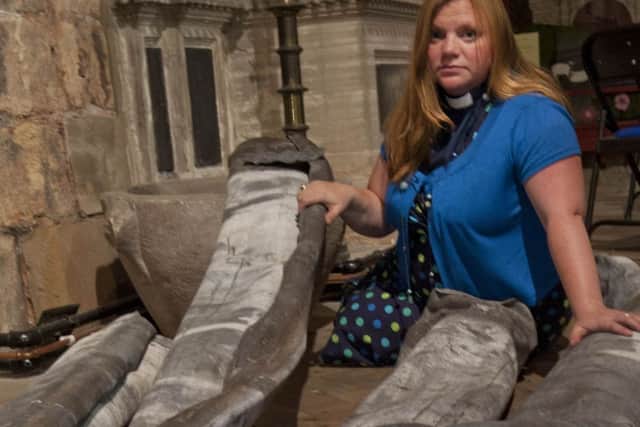 Rev Kate Bottley with the lead stripped from the porch roof of St Mary and St Martin Church, Blyth