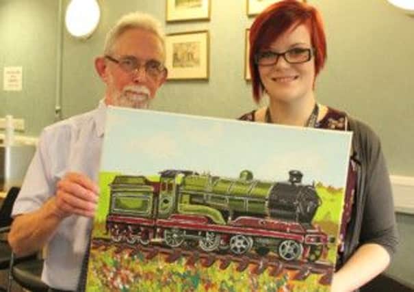David Halstead and Bekky French with the gift she painted for him to mark his retirement after 54 years.