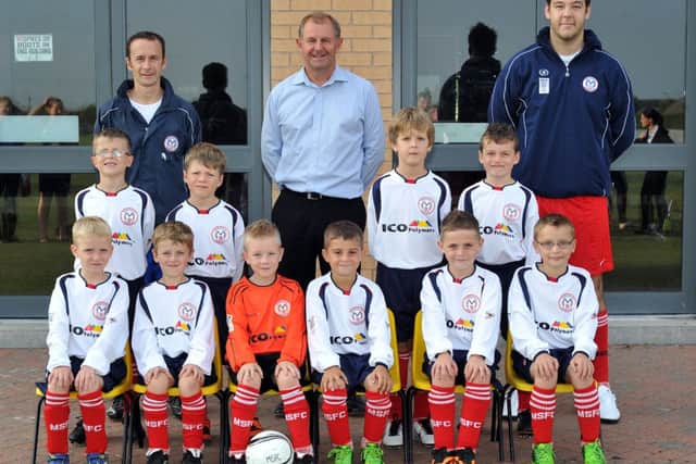 Marshalls U8's in their new kits, pictured are Marhsalls Vikings with sponsor Chris Bridle of ICO Polymers and coaches Phil Overton and Ross Burnett (w130905-2b)