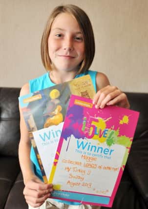 Maggie Anne Grant, 10 collected enough bottletops while on holiday in Turkey to supply a wheelchair for a disabled child, Maggie Anne is pictured with her certificates