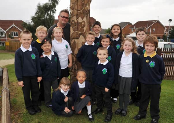 Sculptor Simon Kent has been working with children of Gateford Park Primary School to design a sculture for the school grounds, Simon is pictured with some of the children who helped to design the new feature (w130917-4)