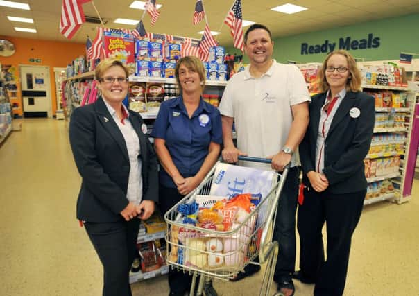 Tesco Celtic Point are supporting 7 Project with the donation of food items, pictured from left are store manager Karen Farrar, customer assistant Rachael Duffy, 7 Project's Shaun Cummings and store deputy manager Joanne Leibrick (w130923-5a)