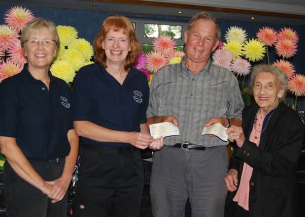 Show Secretary, Brian Johnson, to (from left) Mary Riches and Libby Stennett (Five Villages First Responders) and Vera Millns (Bassetlaw Learning Disability Association