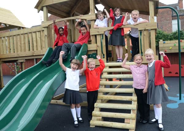 Pupils at Parish Church School in Gainsborough have some new play equipment G130913-5a