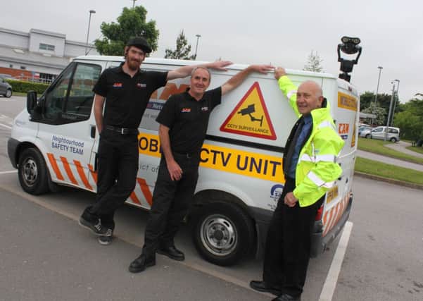 Coun Brian-Murray-Carr (right) with two of the councils CAN rangers showing off the new camera