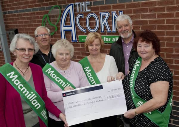 The Acorn Theatre hosted a Macmillan Coffee Morning and raised £906.20 for the charity. Pictured with the cheque are volunteers (left to right); Chris Hagen, Terry Pearson, Rosemary Stevenson,Carol Bonser, Roger Westwood and Angela Pearson