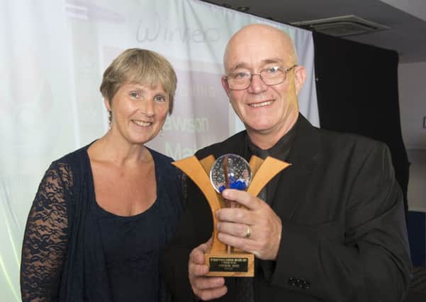 Lawson Main receives his award from Frances Flaxington