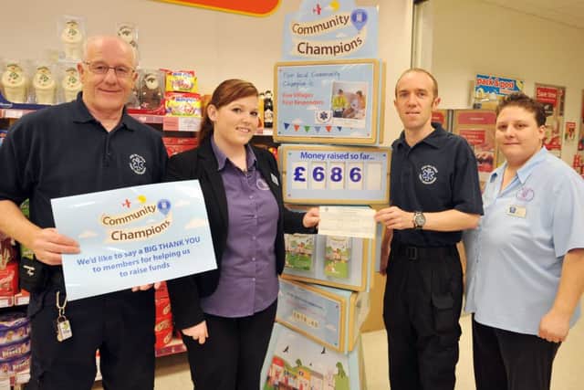 Lincolnshire Cooperative Society have raised £686 for Five Villages First Responders through their Community Champion scheme at Misterton Coop, pictured from left are first responder Colin Gibson, store deputy manager Andi Jones, first responder Martyn Johnson and store supervisor Emma Wilson (w131016-2a)